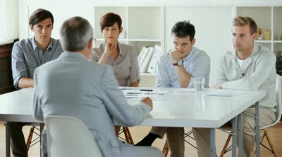stock-footage-employees-listening-intently-to-their-ceo-presenting-a-review